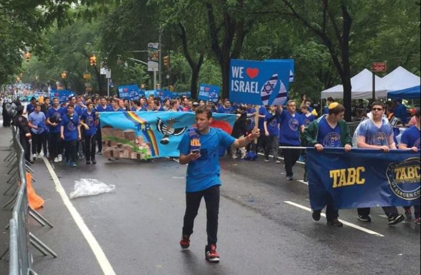 CELEBRANTS MARCH in the Celebrate Israel Parade on Fifth Avenue in Manhattan yesterday, alongside Central Park. (photo credit: SHIMON MERCER WOOD)