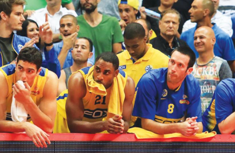 Idan Paz (right) and forward Itay Segev (left) are expected to remain at Maccabi Tel Aviv for another season to continue their development, but Ike Ofoegbu (second left) and Dagan Yivzori (second right) will be among those who will pay the price for the dejecting 2015/16 campaign (photo credit: ERAN LUF)