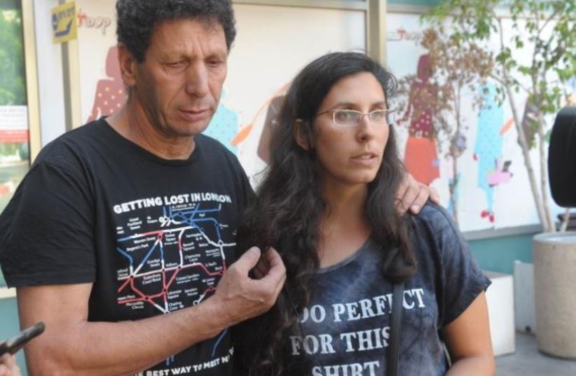 Avner Bar and Dana Cohen, the father and sister of Tel Aviv terror shooting victim Asaf Bar (photo credit: AVSHALOM SASSONI)