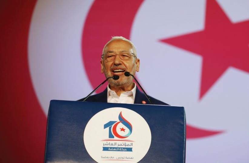 RACHED GHANNOUCHI, leader of the Islamist Ennahda movement, speaks during the movement’s congress in Tunis, May 20. (photo credit: REUTERS)