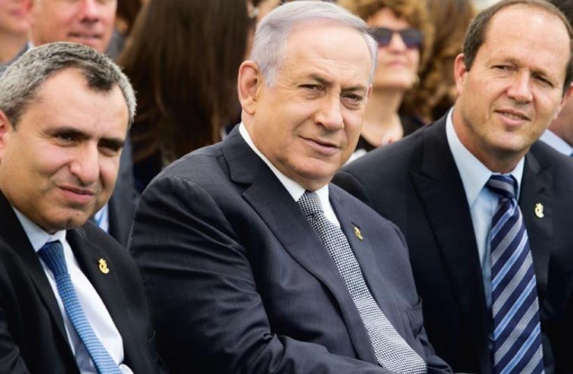 (From right) Barkat, Prime Minister Benjamin Netanyahu and Likud MK Ze’ev Elkin (who also serves as Jerusalem affairs minister) attend a special cabinet meeting at Ammunition Hill marking Jerusalem Day on May 20 (photo credit: MARC ISRAEL SELLEM)