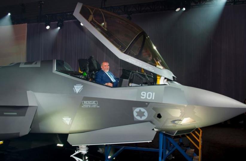 Israel’s Minister of Defense Avigdor Liberman views the cockpit of the first Israeli Air Force (IAF) F-35A Lightning II (photo credit: LOCKHEED MARTIN PHOTO BY BETH STEEL)