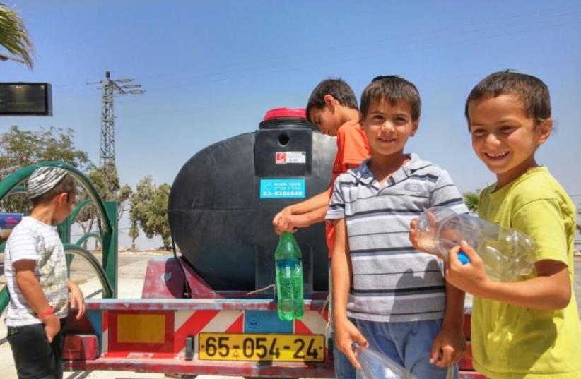 Water distribution in the Migdalim settlement in the Samaria Region (photo credit: MIGDALIM SECURITY)