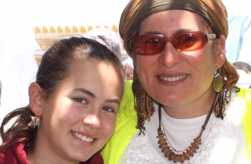 Hallel Yaffa Ariel (L) who was killed in a terrorist stabbing in Kiryat Arba on June 30, 2016 is pictured with her mother in a photograph from 2015 (photo credit: COURTESY ADAM PROP)