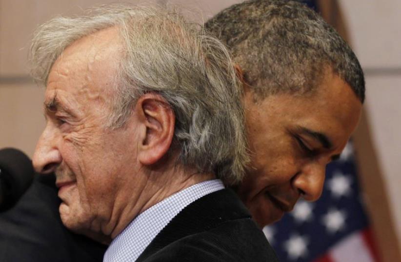 US President Barack Obama hugs Nobel Laureate and Holocaust survivor Elie Wiesel as Wiesel introduced him to speak at the United States Holocaust Museum in Washington, April 23, 2012.  (photo credit: REUTERS/JASON REED)