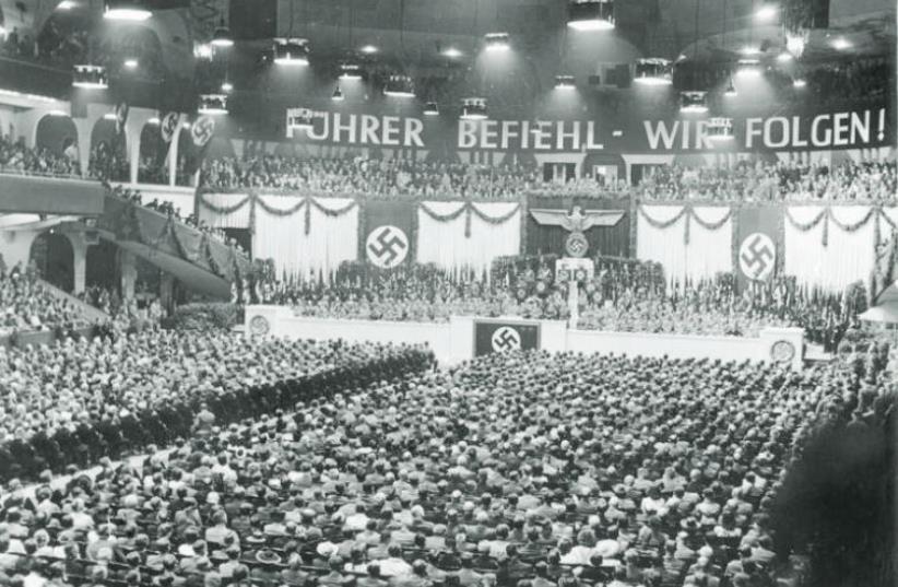 Germans take part in a mass Nazi rally in the Berlin Sports Palace in June 1943 (photo credit: Wikimedia Commons)