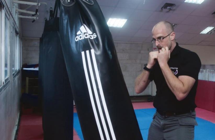 Doing martial arts since age four: David Djaoui works the punching bag (photo credit: MARC ISRAEL SELLEM)