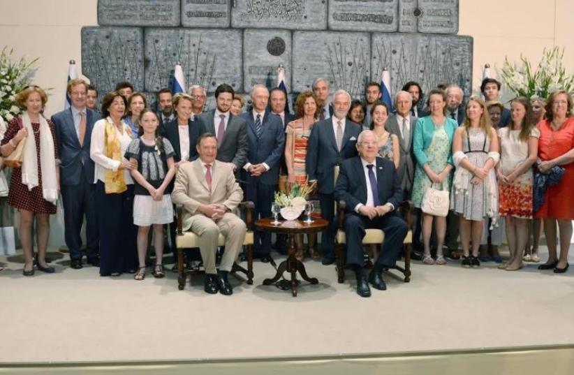 Prince Michel de Ligne (front left) and descendants of a Belgian royal house meets President Reuven Rivlin (front right) and Jews saved by the family during the Holocaust, Jerusalem, July 13, 2016 (photo credit: PRESIDENTIAL SPOKESPERSON OFFICE)