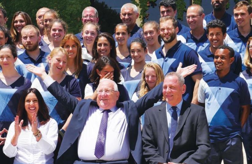 THE ISRAELI delegation to upcoming the Rio Olympics poses with President Reuven Rivlin at his residence in Jerusalem yesterday. (photo credit: JACK BROOK)