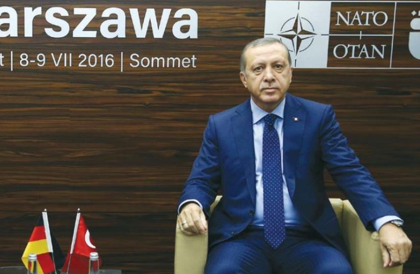 TURKISH PRESIDENT Tayyip Erdoga at the NATO summit in Warsaw last Saturday. (photo credit: REUTERS)