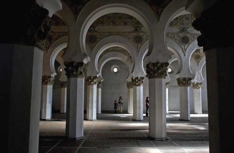 Tourists visit Toledo’s Santa Maria La Blanca, a former synagogue dating back to the 12th century (photo credit: REUTERS)