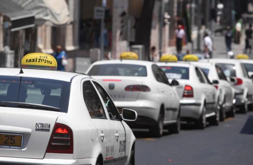 Taxis on Jerusalem's King George Street (photo credit: MARC ISRAEL SELLEM/THE JERUSALEM POST)