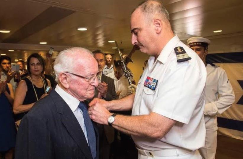DR. RENE KARAT receives the French Legion of Honor from Captain Laurent Sudrat in Haifa. (photo credit: Courtesy)