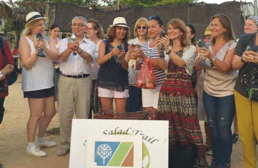 EDUCATORS FROM France and Belgium pose with doves on a visit last week to the Hebesor Region ‘Salad Trail’ in the Negev, sponsored by Keren Kayemeth LeIsrael-Jewish National Fund. (photo credit: LAURENCE KIMAN)