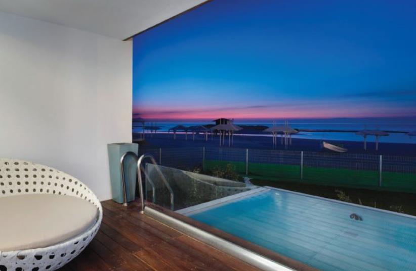 STRIKING SUNSET colors dominate twilight views from luxurious seaside rooms at Nahsholim. (photo credit: Courtesy)