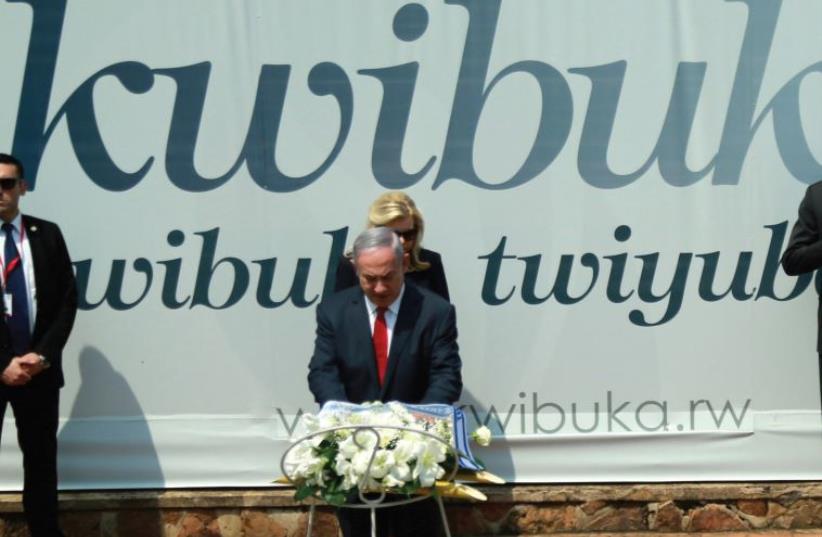 PRIME MINISTER Benjamin Netanyahu lays a wreath as Rwandan President Paul Kagame and First Lady Jeannette Kagame watch at the Genocide Museum near Kigali, Rwanda, earlier this month (photo credit: REUTERS)