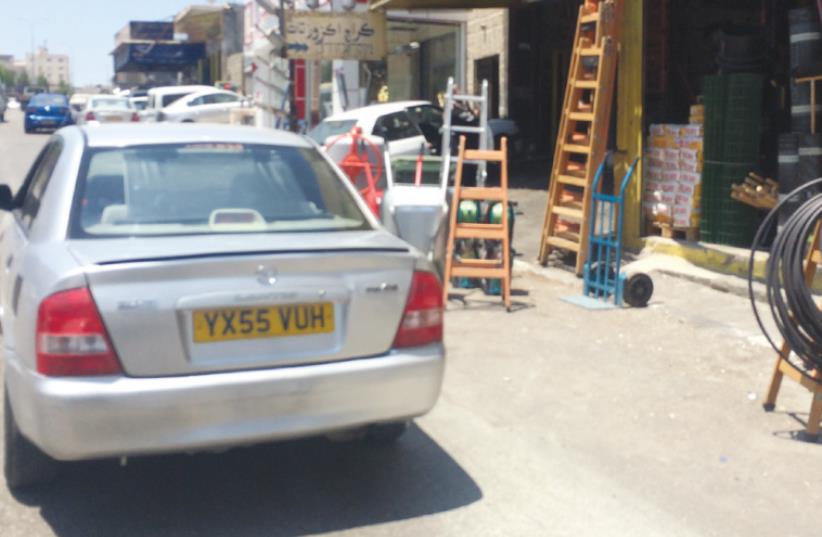 AN ILLEGAL late-model Mazda with false plates is seen yesterday on the main road of Eizariya. (photo credit: ADAM RASGON)