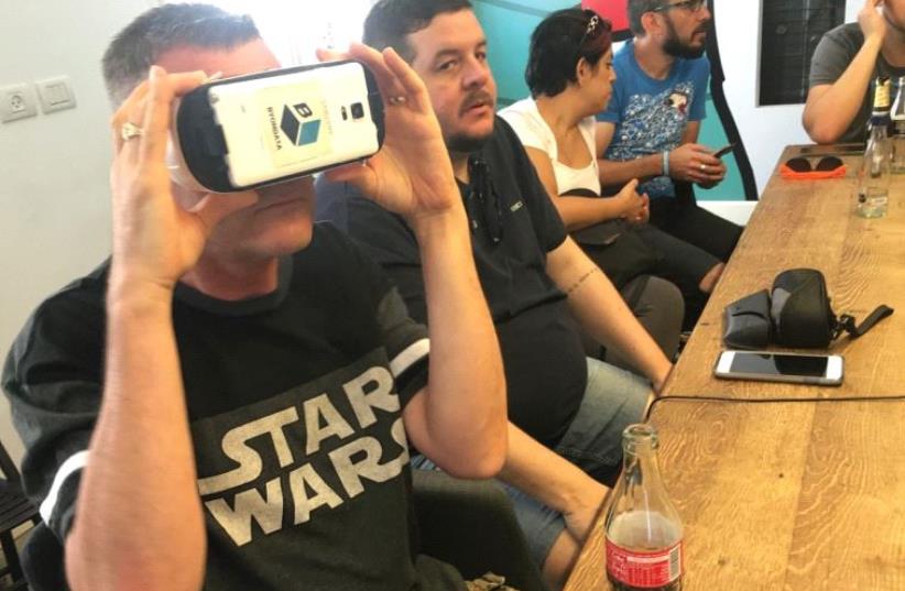 CONFERENCE GUESTS try out a ByonData virtual experience in Tel Aviv yesterday. (photo credit: NIV ELIS)
