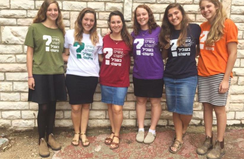 The result of three high school girls’ sheer chutzpah: The T-shirts with the ‘Have we done something for someone else?’ slogan have raised NIS 160,000, distributed to nonprofits (photo credit: Courtesy)