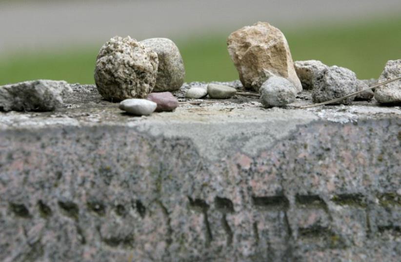 Stones lie on a tombstone in a Jewish cemetery in Vilnius August 7, 2007 (photo credit: REUTERS)