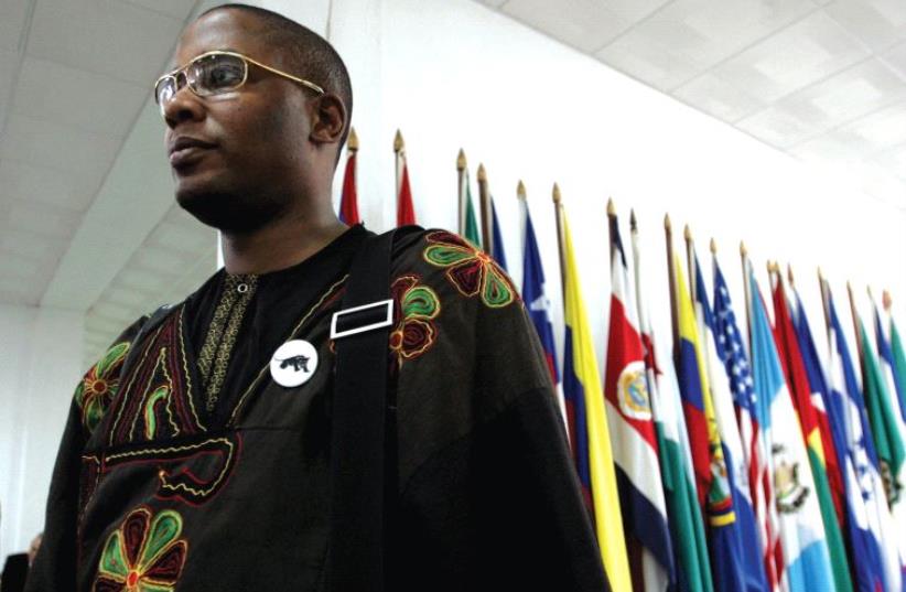 MALIK ZULU SHABAZZ, chairman of the New Black Panther Party and a member of Nation of Islam leader Louis Farrakhan’s delegation, visits the Latin American Medical School in Havana in 2006. (photo credit: REUTERS)