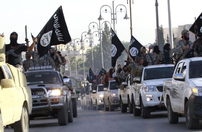Islamic State holds a parade in Raqqa in June, 2014 (photo credit: REUTERS)