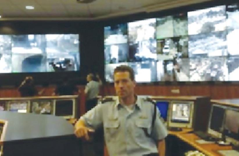 POLICE SPOKESMAN Micky Rosenfeld stands inside the state-ofthe- art police headquarters, Mabat 2000, in the capital’s Old City’s. (photo credit: ISRAEL POLICE)