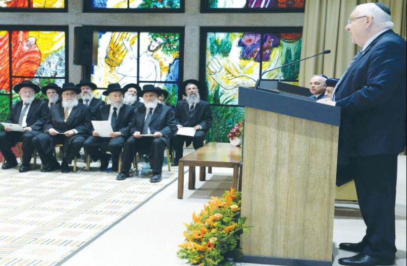 PRESIDENT REUVEN RIVLIN addresses the new members of the Supreme Rabbinical Court yesterday during their investiture at the President’s Residence in Jerusalem. (photo credit: MARK NEYMAN / GPO)