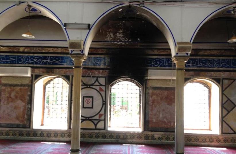 The Al-Jazzar mosque after the fire (photo credit: ELIYAHU KAMISHER)