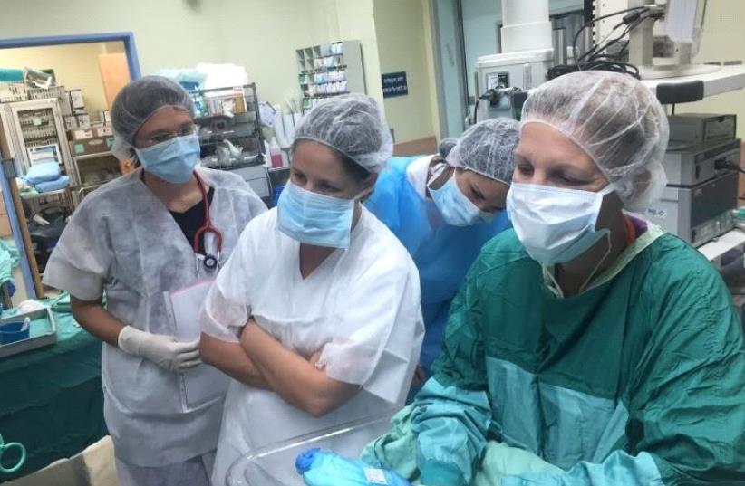 Operating room staff at cesarean section. (photo credit: KAPLAN MEDICAL CENTER)
