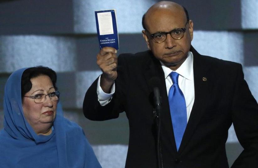 Khizr Khan, whose son, Humayun S. M. Khan was one of 14 American Muslims who died serving in the U.S. Army in the 10 years after the 9/11 attacks, offers to loan his copy of the Constitution to Republican US presidential nominee Donald Trump. (photo credit: MIKE SEGAR / REUTERS)