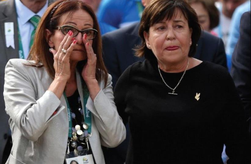 ILANA ROMANO (left) and Ankie Spitzer – widows of two of the murdered Israeli athletes at the 1972 Munich Olympics – attend yesterday’s memorial in Rio. (photo credit: REUTERS)