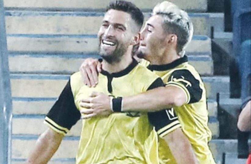 Beitar Jerusalem striker Itay Shechter celebrates his first goal of the season with Omer Atzili (right), who netted the team’s opener in last night’s 3-0 win over Jelgava of Latvia in the second leg of the Europa League third qualifying round. (photo credit: DANNY MARON)