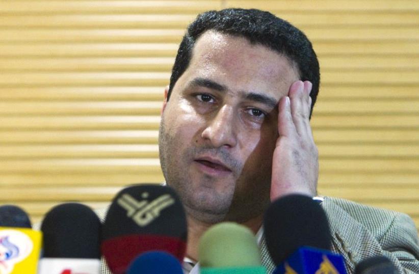 Iranian scientist Shahram Amiri speaks with journalists as he arrives at the Imam Khomini airport in Tehran July 15, 2010 (photo credit: REUTERS)