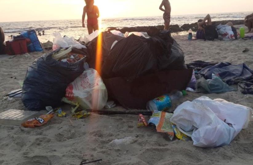 Litter on Mikhmoret Beach near Hadera. (photo credit: ENVIRONMENT PROTECTION MINISTRY)