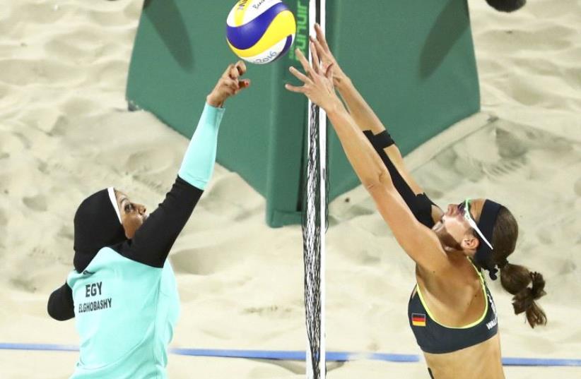 Egyptian and German beach volleyball players compete in 2016 Rio Olympics (photo credit: REUTERS)