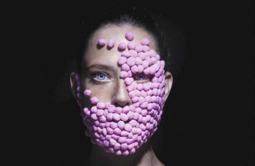 ‘Woman with pink cotton balls on her face’: Depicting women’s chameleon-like ability to transition from one emotional state to the next (photo credit: NIRIT AHARONI)