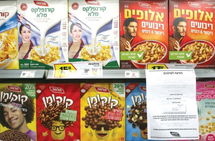 A notice is seen next to packages of Telma cereals warning shoppers of some of the company’s hazardous products (photo credit: MARC ISRAEL SELLEM)