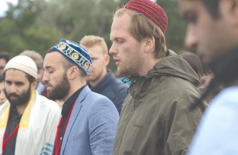 PARTICIPANTS IN THE Muslim Jewish Conference take part in interfaith prayer last week at the site of the Sachsenhasuen concentration camp in Oranienburg, Germany (photo credit: DANIEL SHAKED)