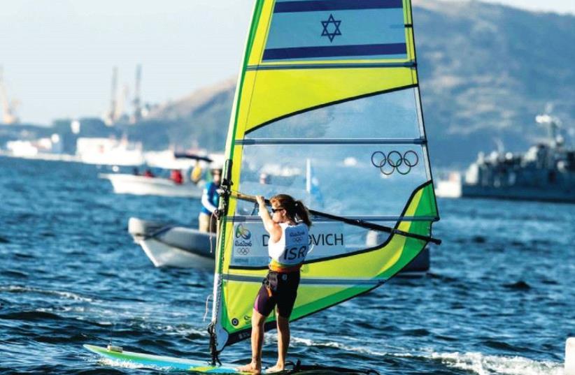 Windsurfer Maayan Davidovich came agonizingly close to winning Israel's 10th Olympic medal yesterday, but ultimately ended the RS:X event in seventh place overall, finishing the decisive medal race in ninth. (photo credit: ASAF KLIGER)