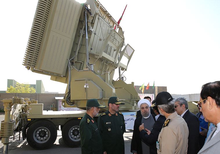 Iran's President Hassan Rouhani (3rd L) and Iranian Defence Minister Hossein Dehghan (2nd L) stand in front of the new air defense missile system Bavar-373, in Tehran, Iran August 21, 2016. (Credit: Reuters)