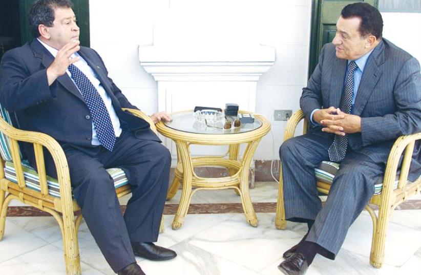 EGYPTIAN PRESIDENT Hosni Mubarak (right) listens to Labor Party head and defense minister Binyamin Ben-Eliezer during their meeting in Alexandria in July 2002. (photo credit: REUTERS)