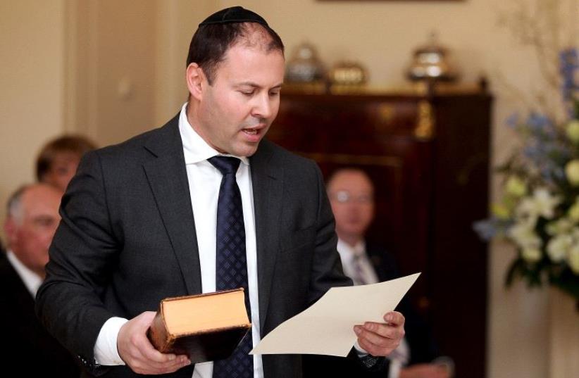 Australia's Minister for Resources, Energy and Northern Australia Josh Frydenberg participates in a swearing-in ceremony at Government House in Canberra, (photo credit: REUTERS)