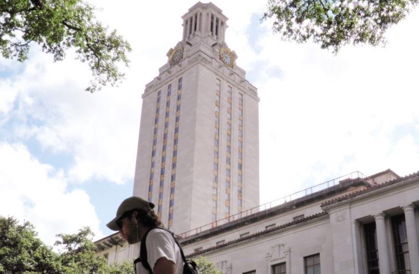 BACK TO school. A student walks at the University of Texas campus in Austin, Texas. (photo credit: REUTERS)