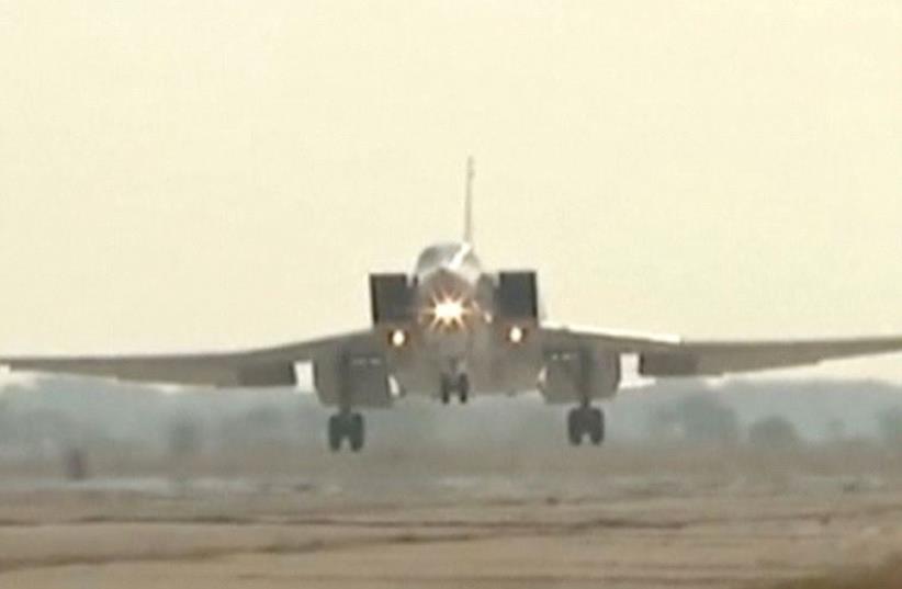 An image released by Russia’s Defence Ministry, August 18, shows a Tupolev Tu-22 long-range bomber landing at an air base near the Iranian city of Hamadan (photo credit: REUTERS)
