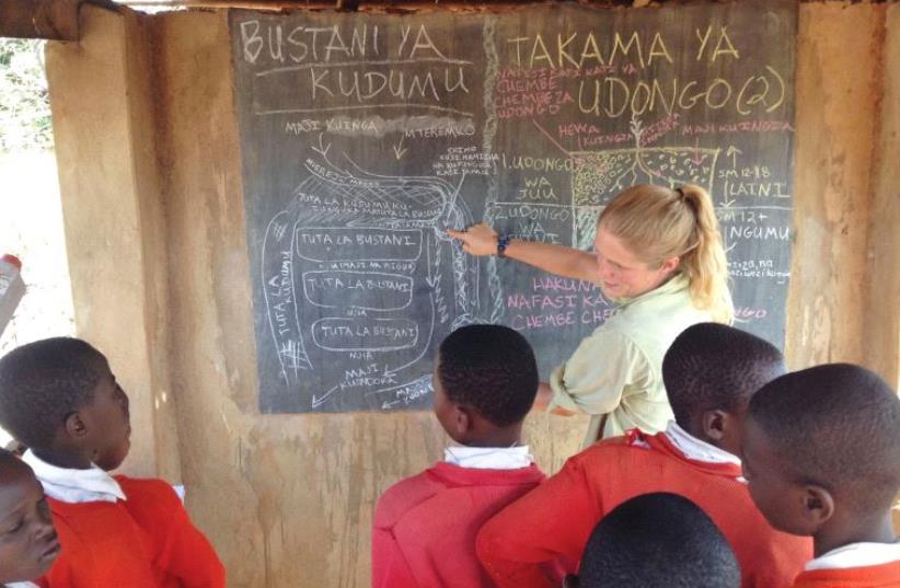 Kirstin Underwood with her Tanzanian students (photo credit: KIRSTIN UNDERWOOD AND ANAV SILVERMAN)