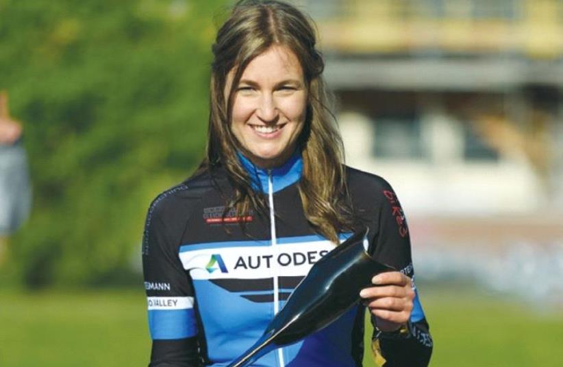 GERMAN CYCLIST Denise Schindler shows off her new prosthesis, produced through 3D printing. (photo credit: AUTODESK)
