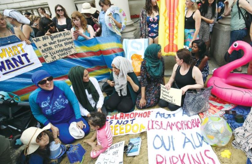Protesters demonstrate against France’s ban of the burkini, outside the French Embassy in London on August 25 (photo credit: REUTERS)