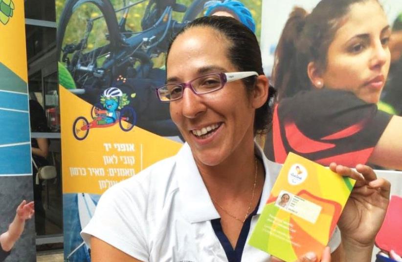 Paralympic rower Moran Samuel poses with her accreditation for the Rio 2016 Games ahead of her departure for Brazil on Tuesday. (photo credit: ISRAEL PARALYMPIC COMMITTEE)