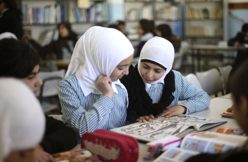 Palestinian students (photo credit: MOHAMAD TOROKMAN/REUTERS)